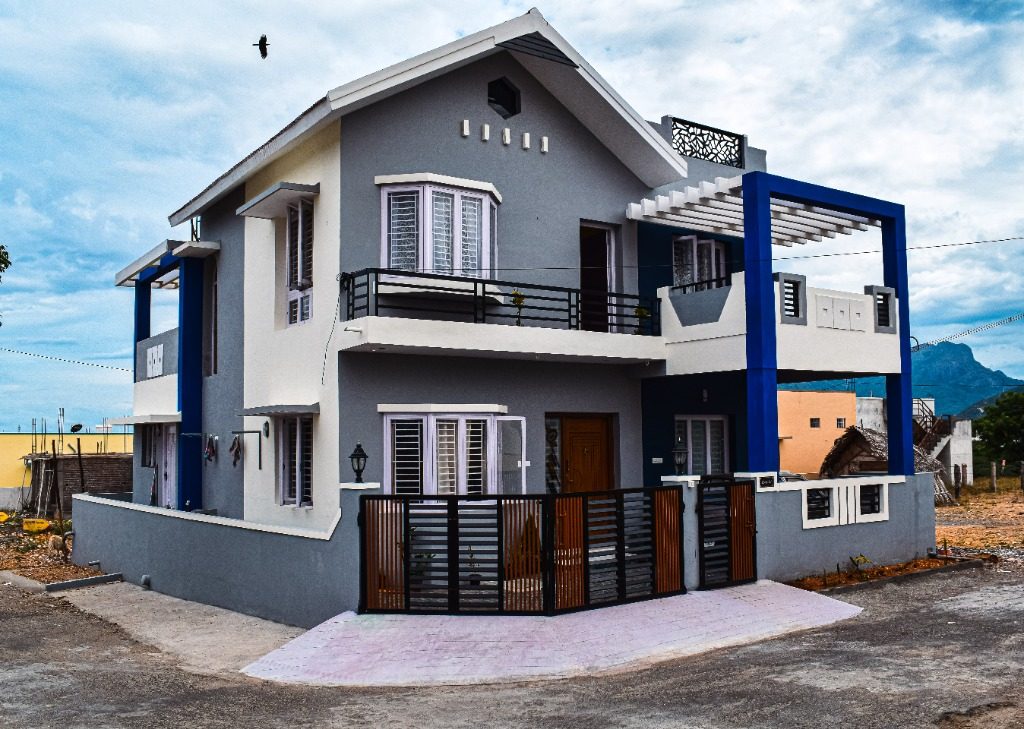 Contemporary villa with royal blue pergola portal built by New Heights Builders