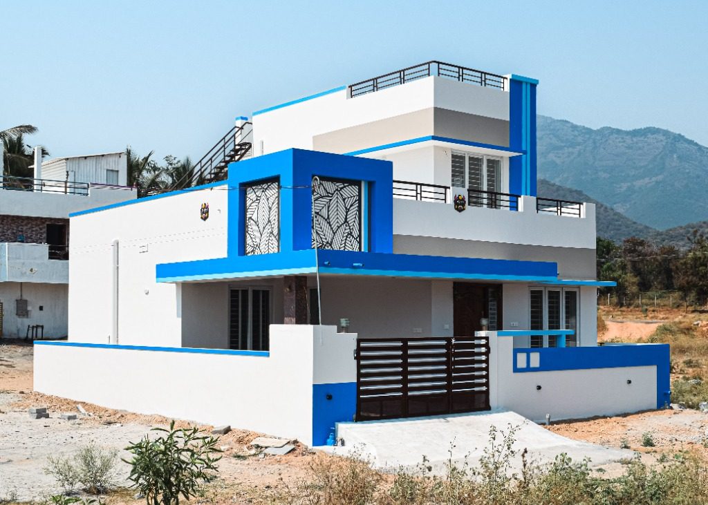 Modernist white and azure blue villa with cuboid architectural frame built by New Heights Builders